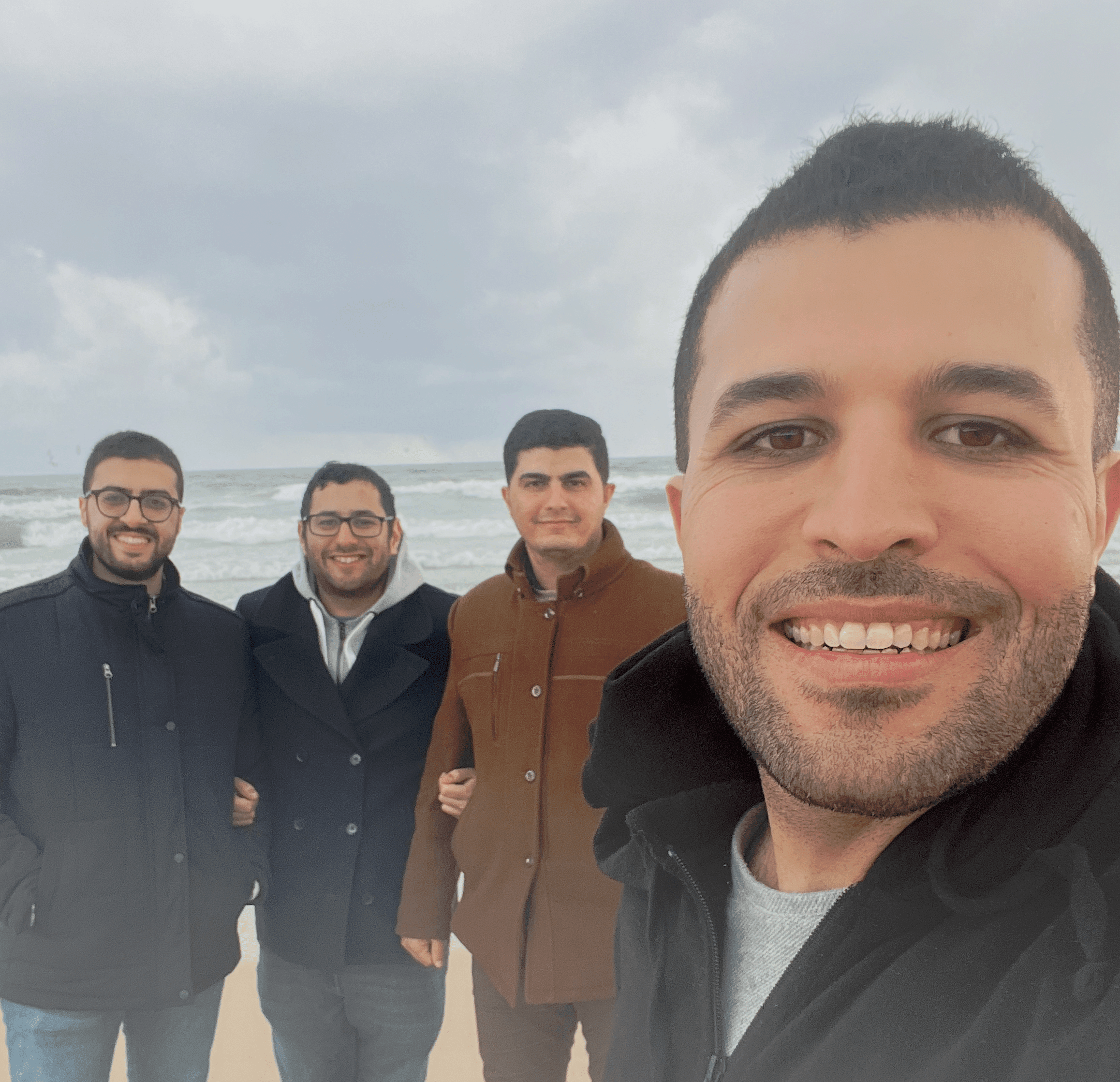 At the beach: Nael, Maisara, Bahzad, and Omar.
